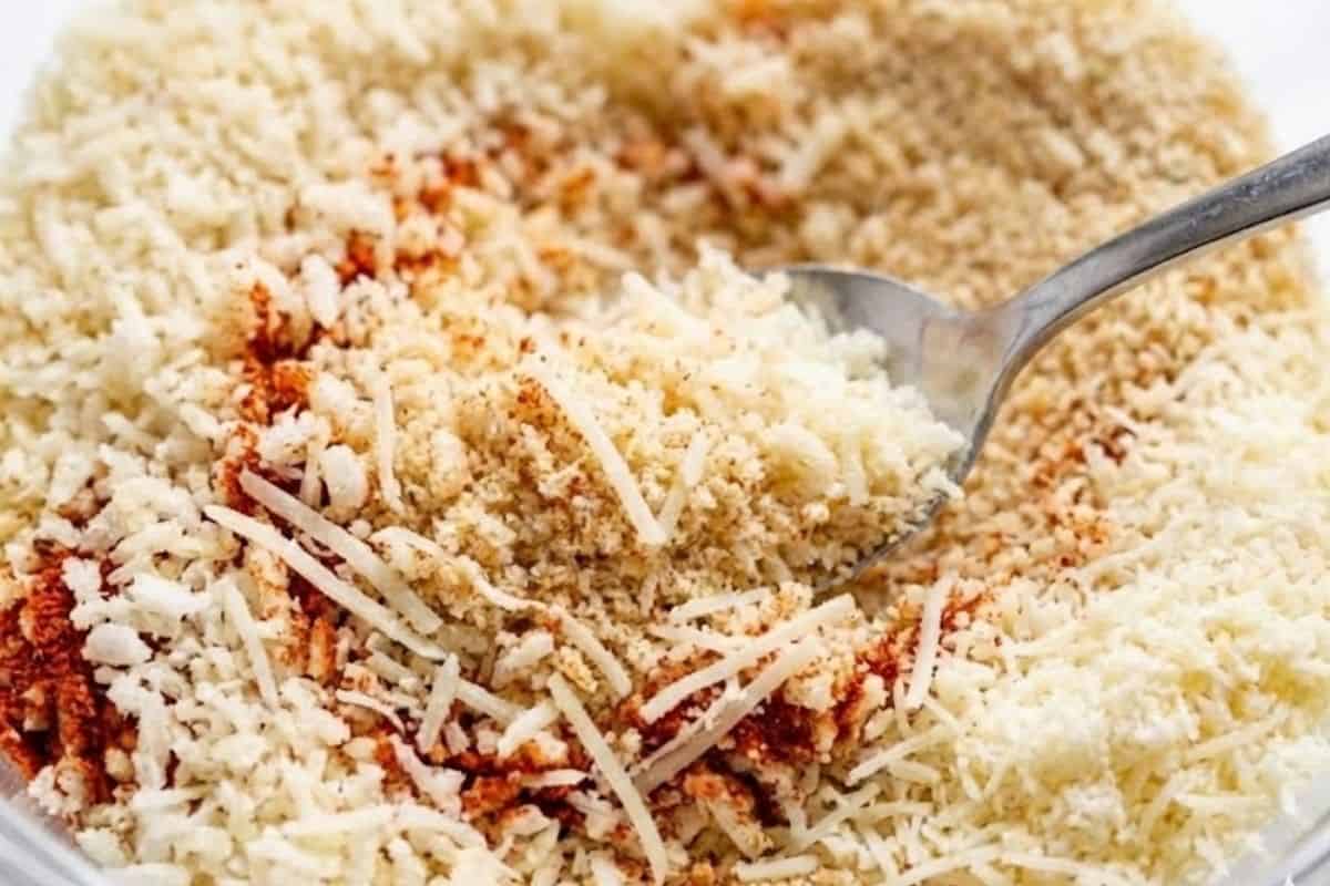 In a bowl, combine Panko breadcrumbs, regular breadcrumbs, paprika, garlic and onion powder, and parmesan cheese.
