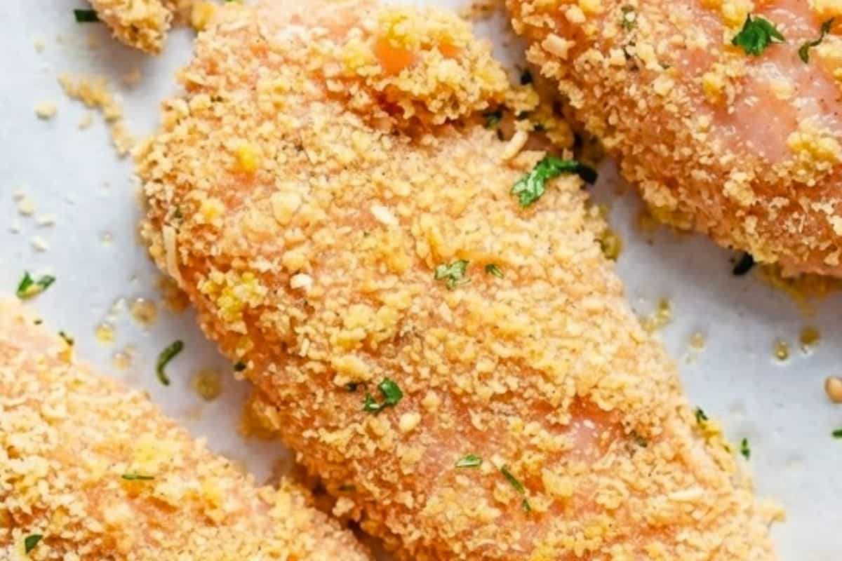 Place the coated tenders on the prepared baking tray