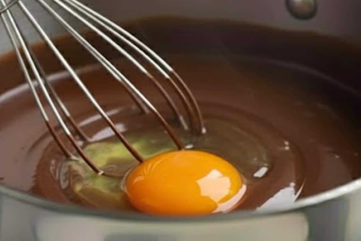 Whisk in flour until smooth, then add eggs one at a time