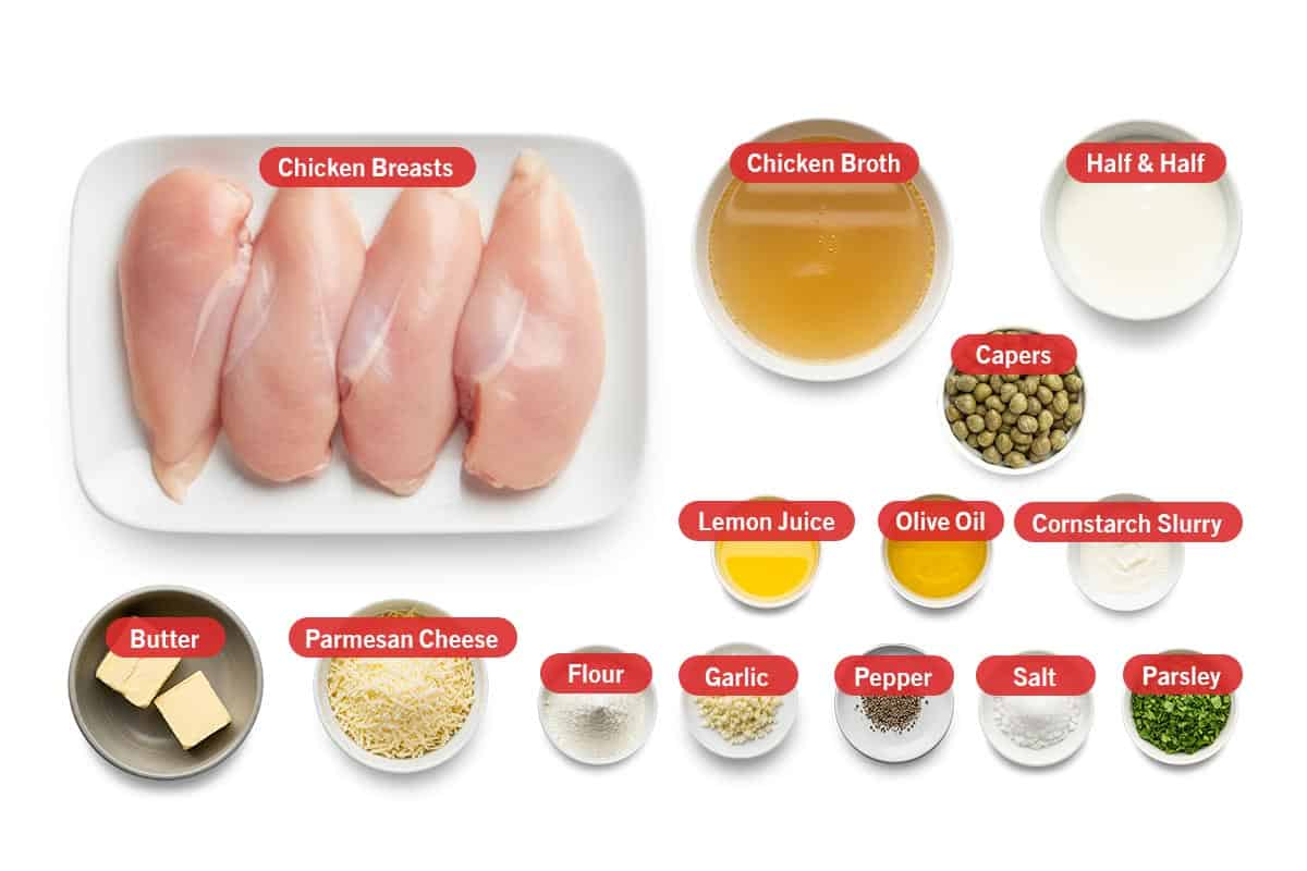 Top shot of ingredients: Chicken breasts, chicken broth, half & half, capers, lemon juice, olive oil, cornstarch slurry, butter, parmesan cheese, flour, garlic, pepper, salt, parsley.