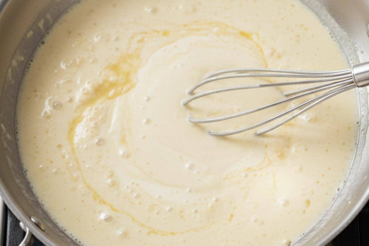 Poured in the chicken broth and cream. Stirring to combine.