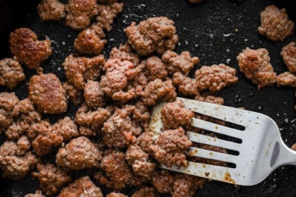 Heat oil in a pan over medium heat and brown the beef, using your spatula to break up any clumps. 