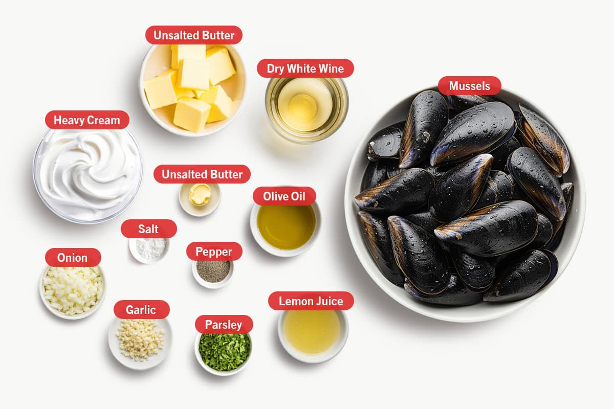 Top shot of ingredients: Mussels, dry white wine, garlic, onion, unsalted butter, heavy cream, olive oil, salt, pepper, parsley and lemon juice.
