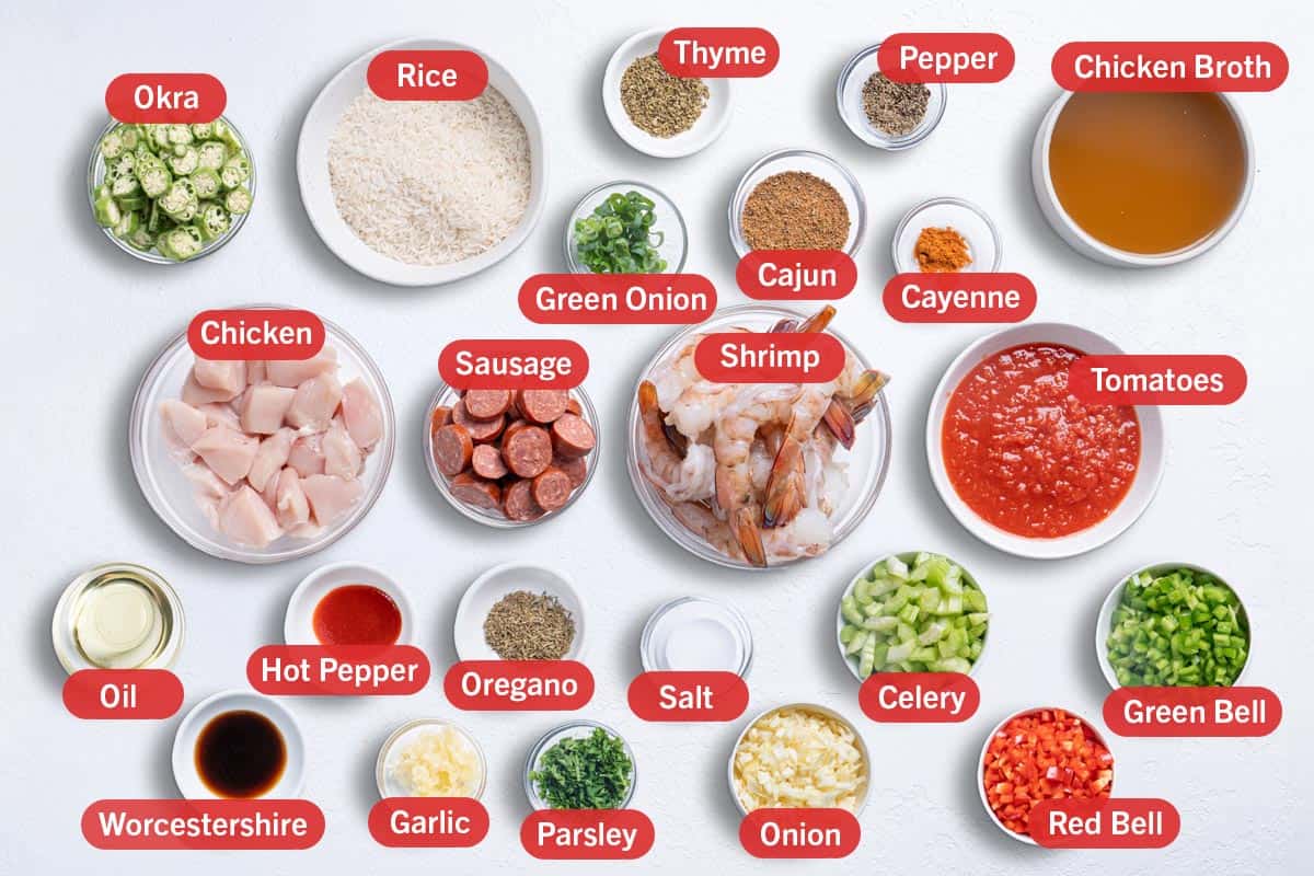 Image of the ingredients needed for the preparation of this recipe, specifically: Okra, rice, thyme, green onion, cajun, pepper, cayenne, chicken broth, chicken, sausage, shrimp, tomatoes, oil, hot pepper, worcestershire, garlic, oregano, parsley, salt, onion, celery, red bell and green bell.