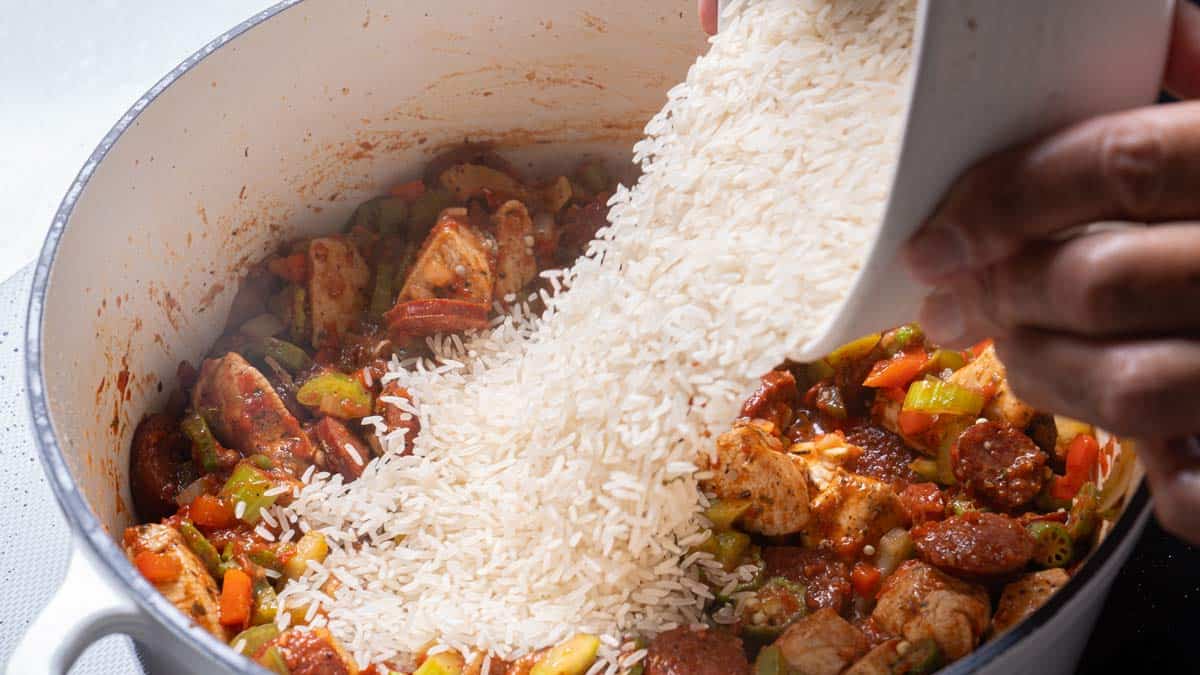 adding the rice in the pot