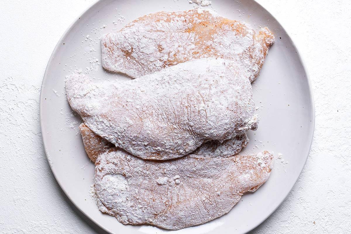 chicken breast seaseoned on a plate