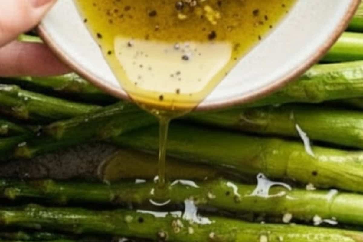 In a small bowl, combine olive oil, salt, pepper and garlic. Drizzle this over the asparagus.