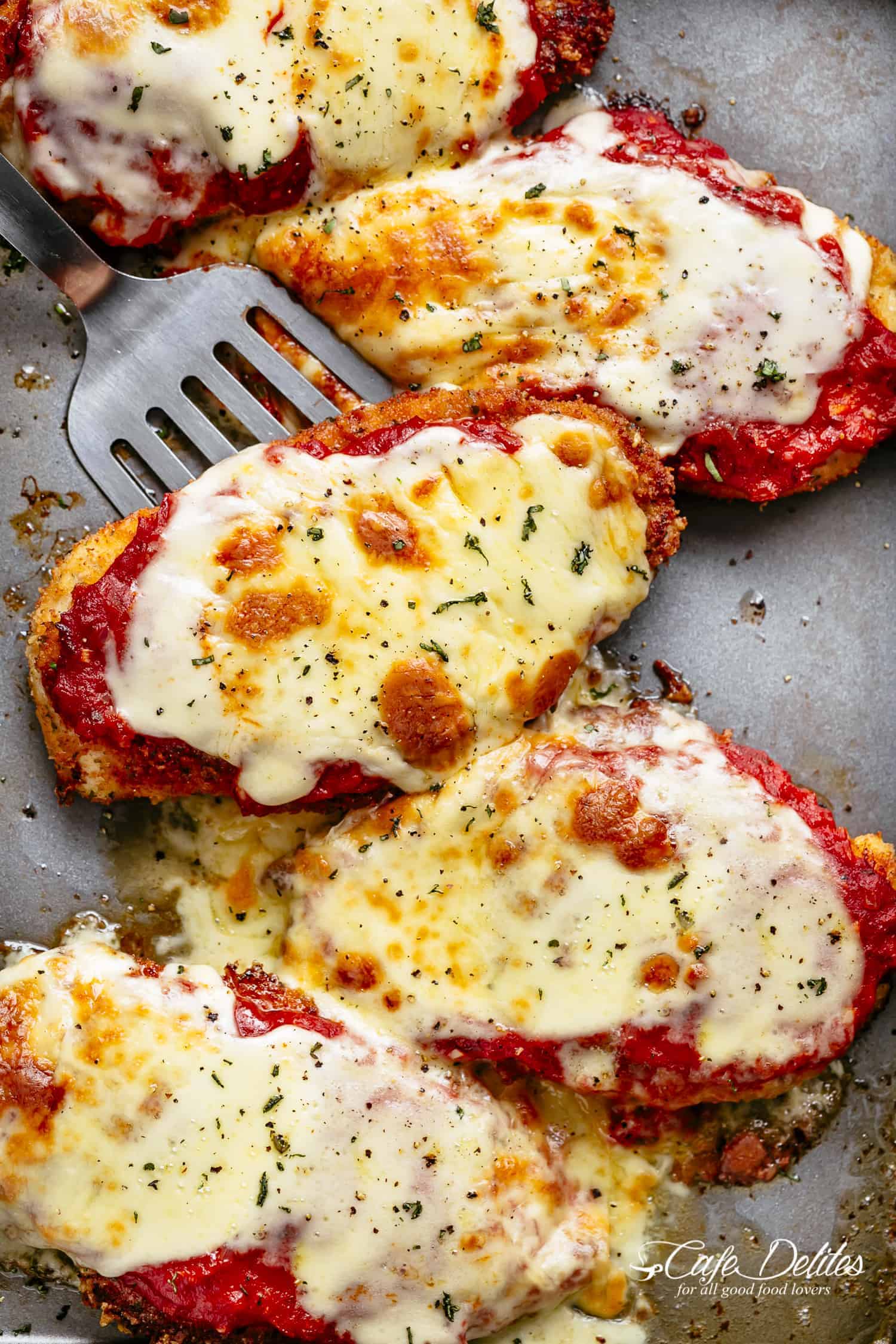 Image of three juicy chicken parmesan breasts