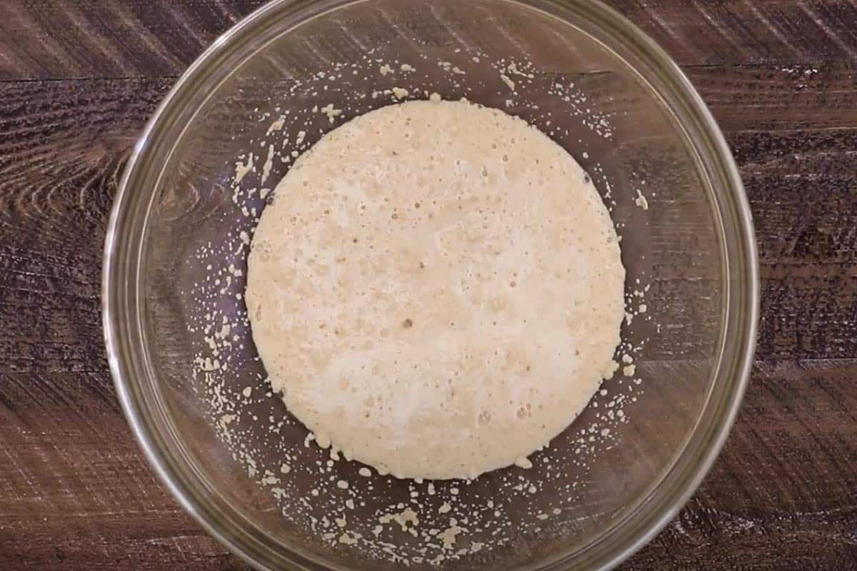 Combined sugar, yeast and warm water in a large bowl.