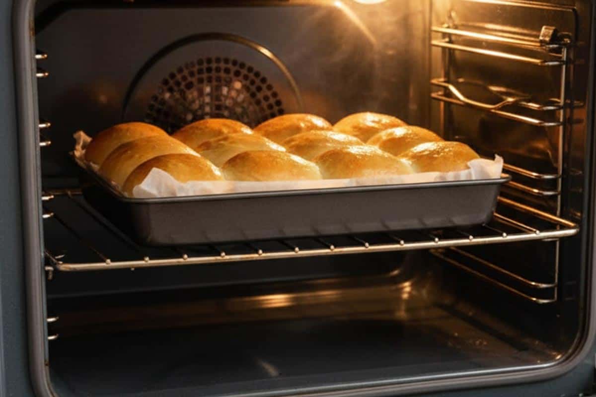Baking the rolls in the oven.