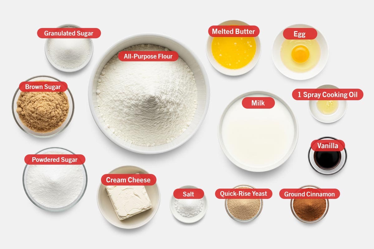 Top shot of ingredients: granulated sugar, all-purpose flour, melted butter, egg, brown sugar, powdered sugar, cream cheese, salt, quick-rise yeast, milk, 1 spray cooking oil, vanilla, and ground cinnamon.
