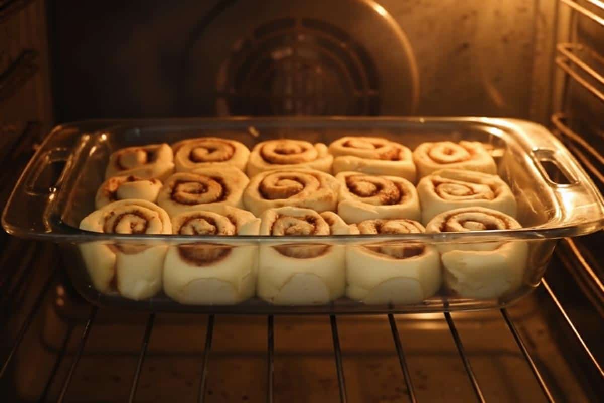 Baking the cinnamon rolls in the oven.