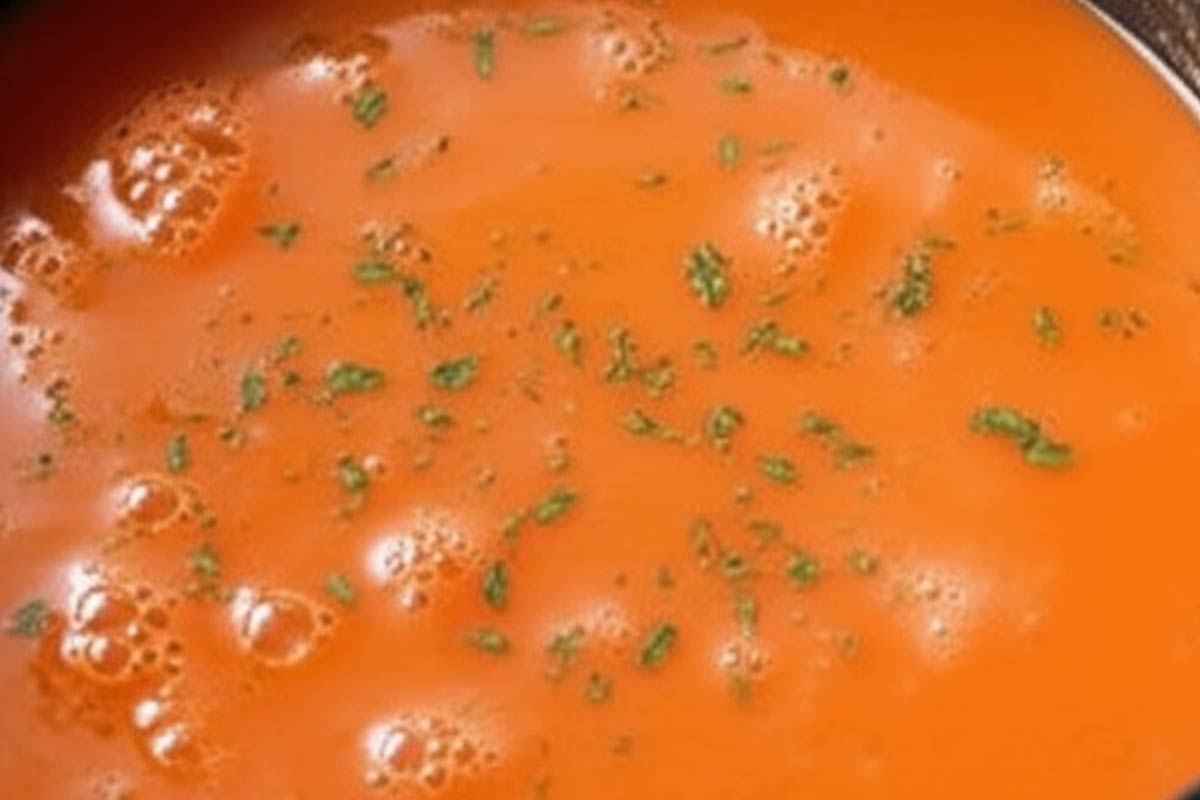 Cooking the soup with a gentle simmer.
