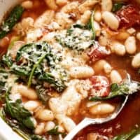 White Bean Parmesan Spinach Soup ready in 10 minutes is may kind of soup! Make a double batch and have plenty of leftovers for the weekly dinner rush! | https://cafedelites.com