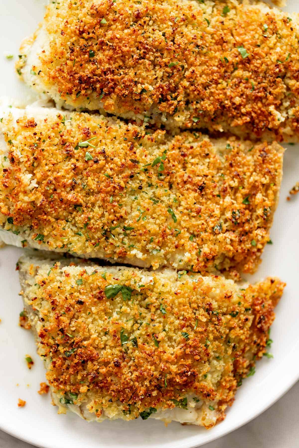 Crumbed fish fillets on a plate. 