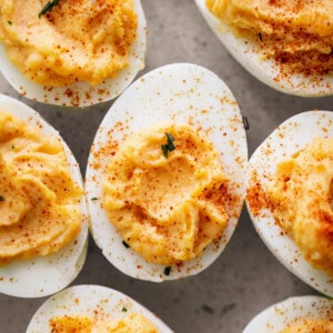 Classic Deviled Eggs with sprinkled spices on top on a plate
