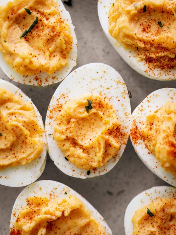 Classic Deviled Eggs with sprinkled spices on top on a plate