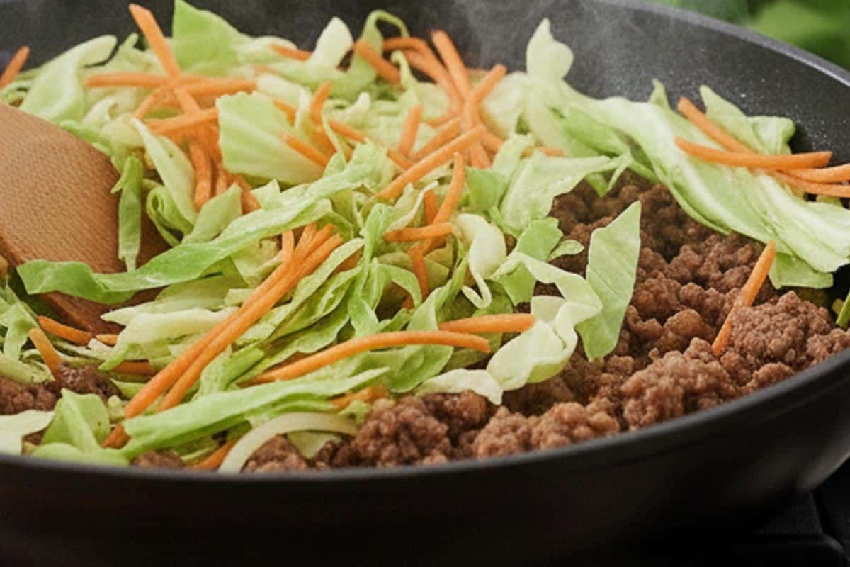 Stirred in the shredded cabbage and carrot.