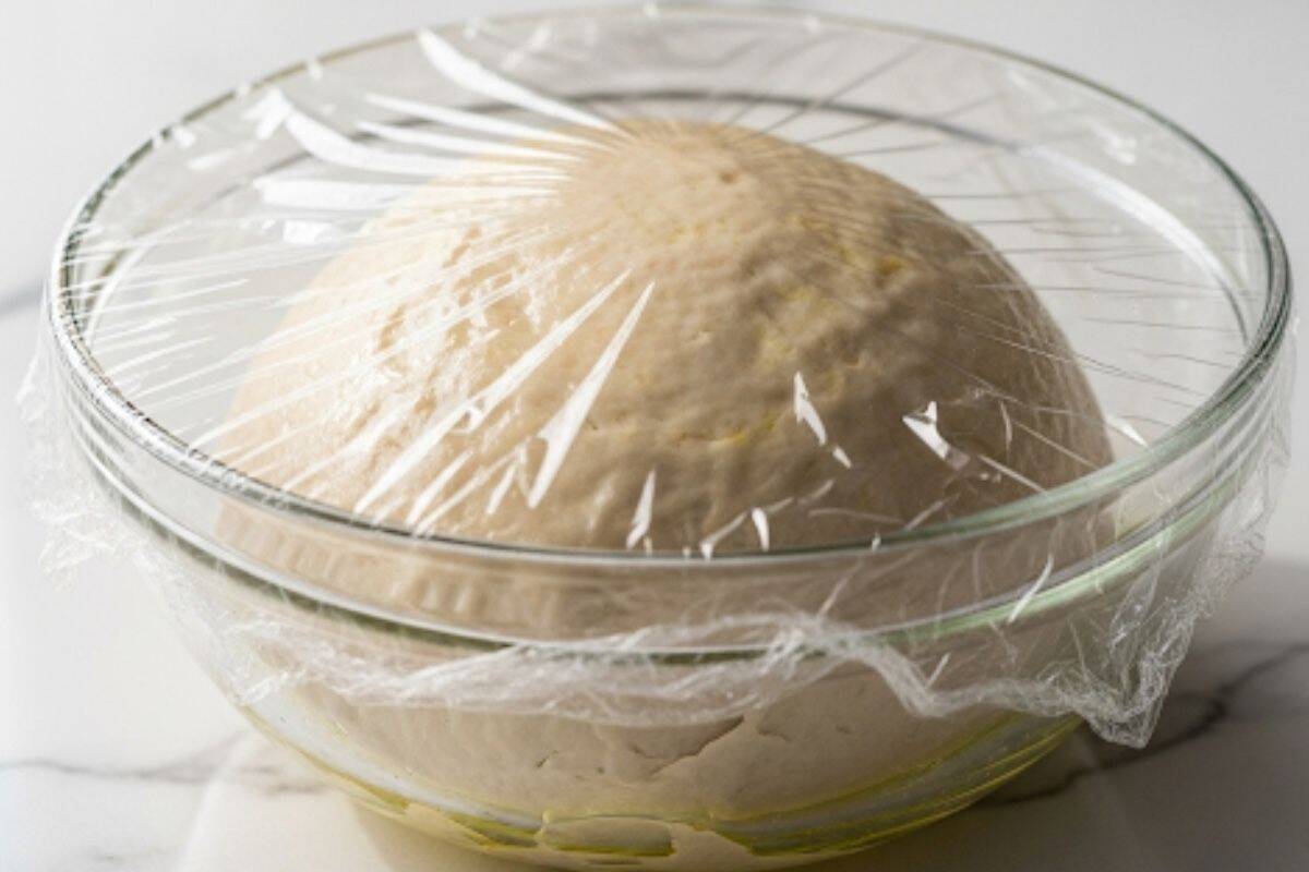 Place the dough in a lightly oiled bowl and cover with plastic wrap.
