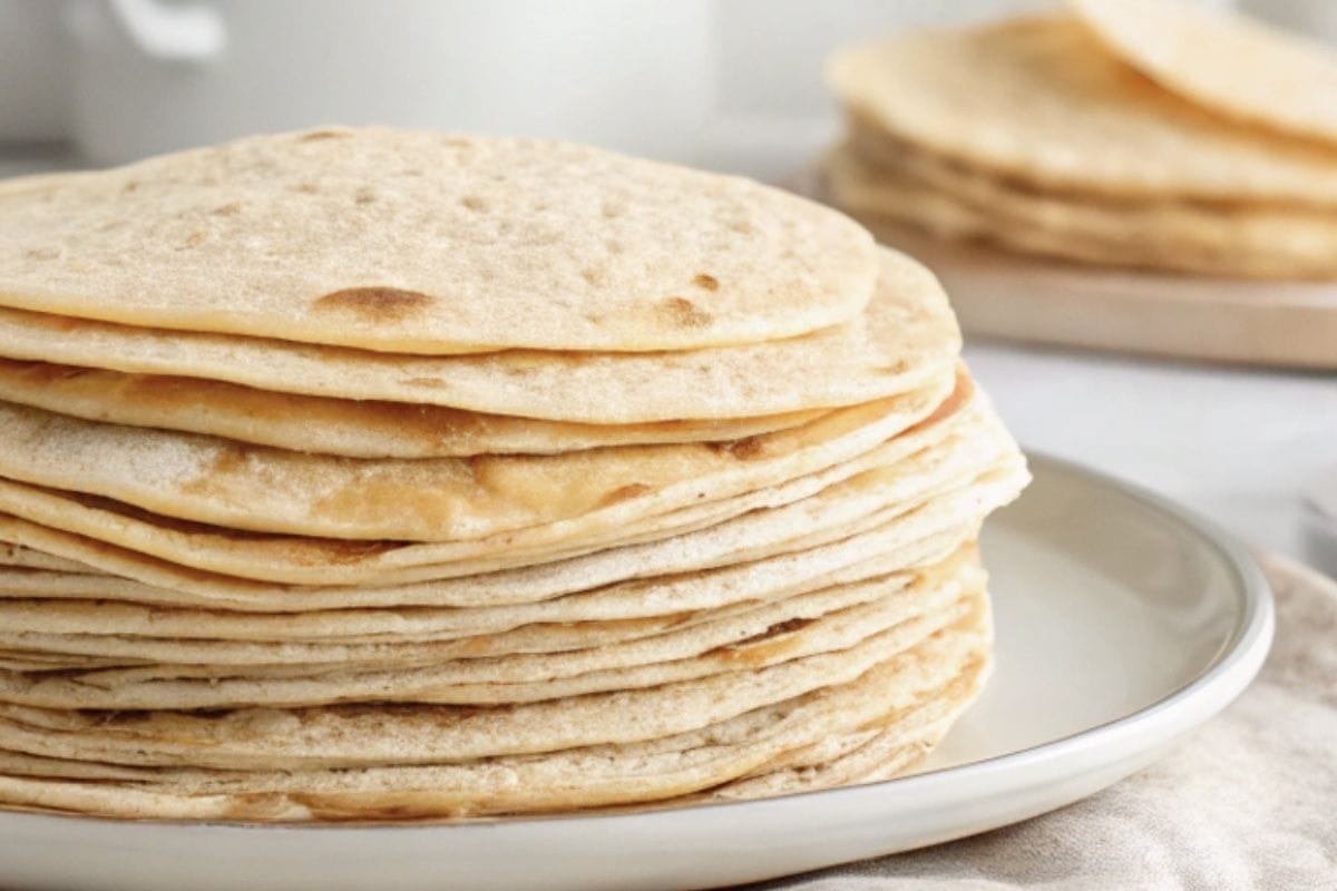 Transfer the cooked tortillas to a plate