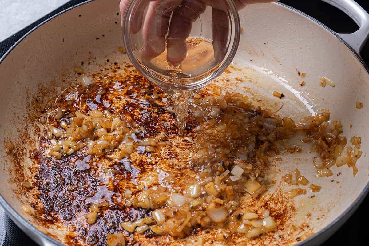 onion, garlic and browned bits in the cream pan with white wine