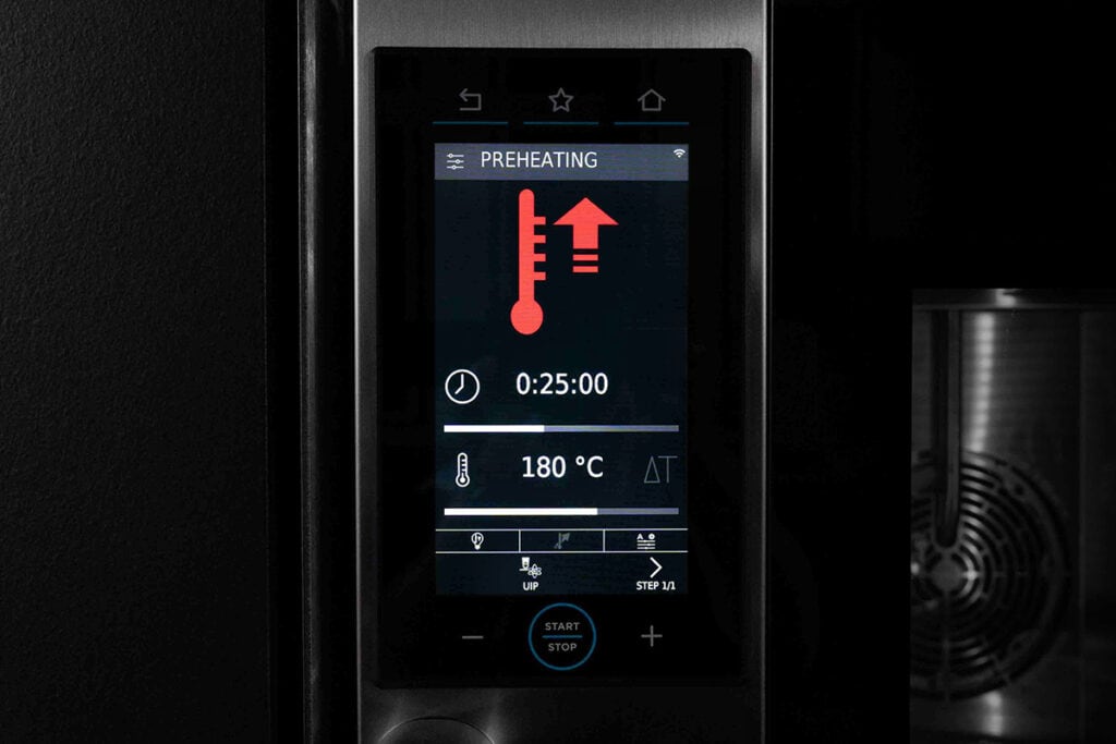 a screen on an electric oven showing the oven heating up to temprature - 9