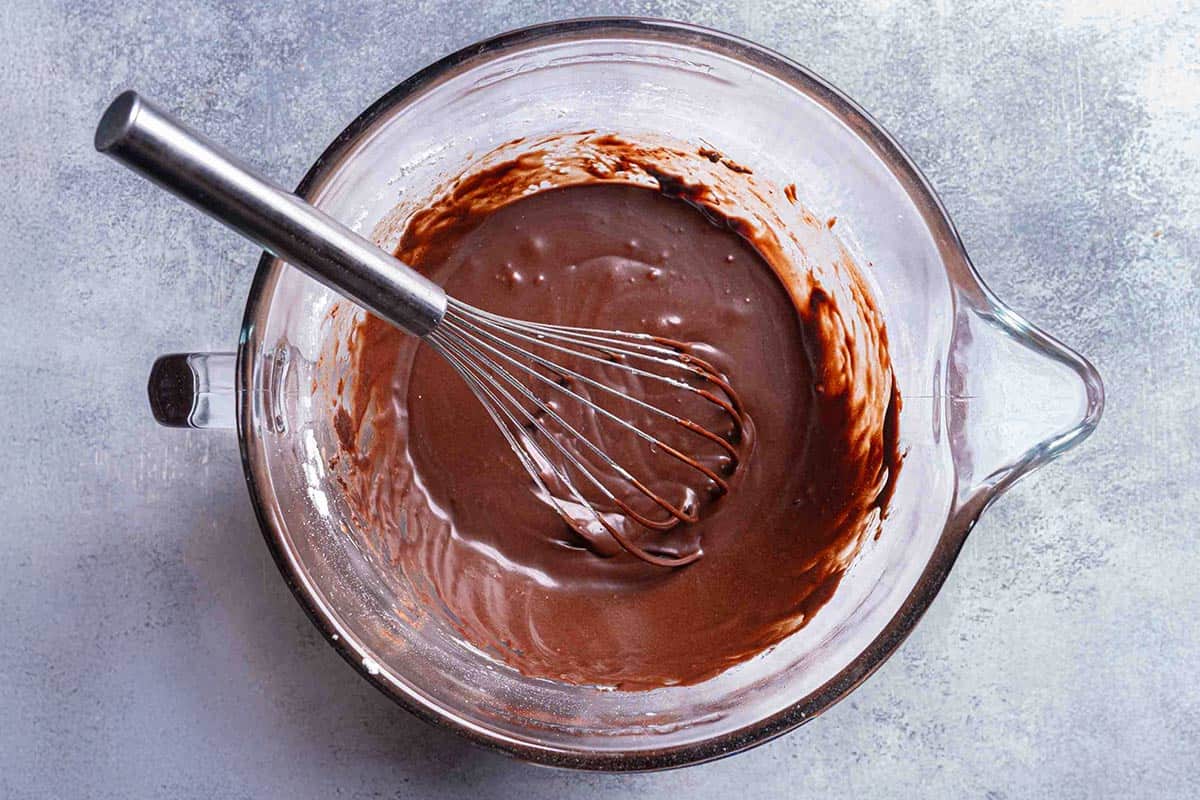 frosting mixture in a clear mixing bowl