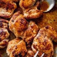 Crispy boneless chicken thighs in a silver pan | cafedelites.com