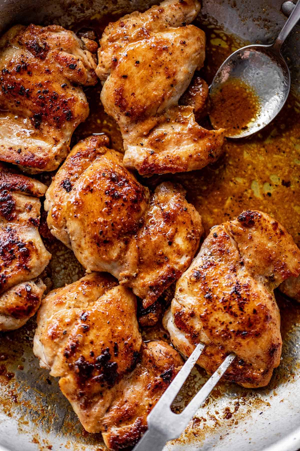 Crispy boneless chicken thighs in a silver pan | cafedelites.com