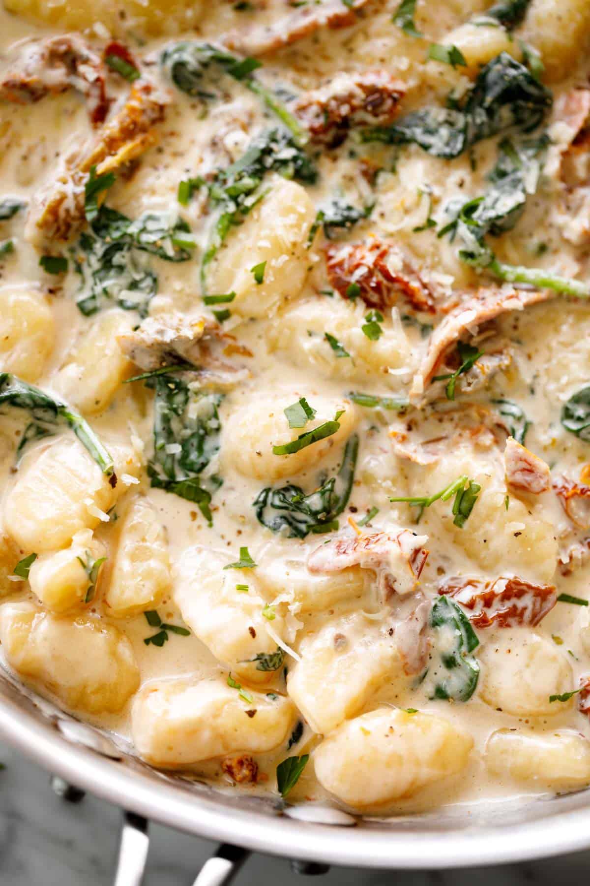 Gnocchi in a skillet with a creamy sun dried tomato sauce | cafedelites.com