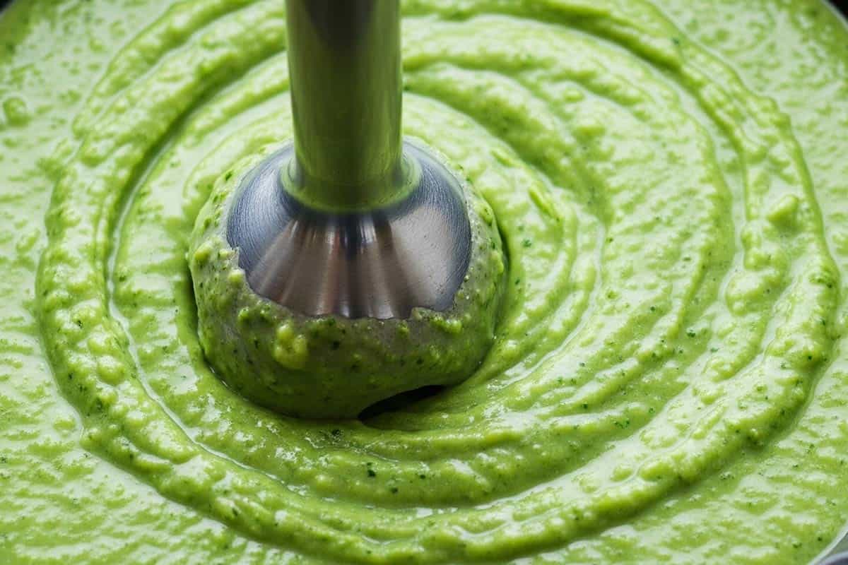 Using immersion blender to make a puree.