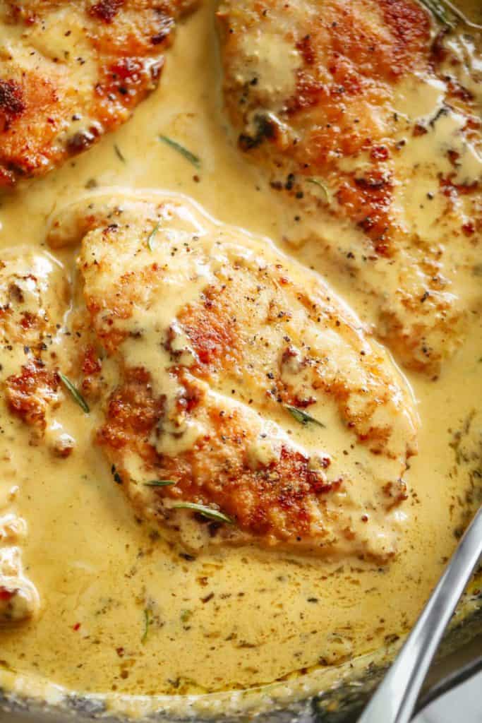 A close up of one chicken breast in a French style Dijon cream sauce | cafedelites.com