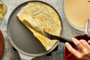 lifting the crepe with a spatula