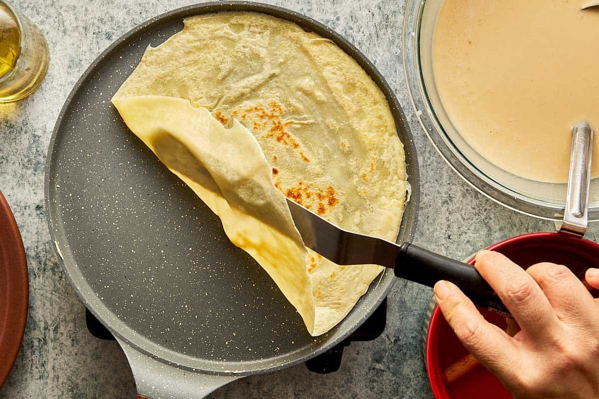 lifting the crepe with a spatula