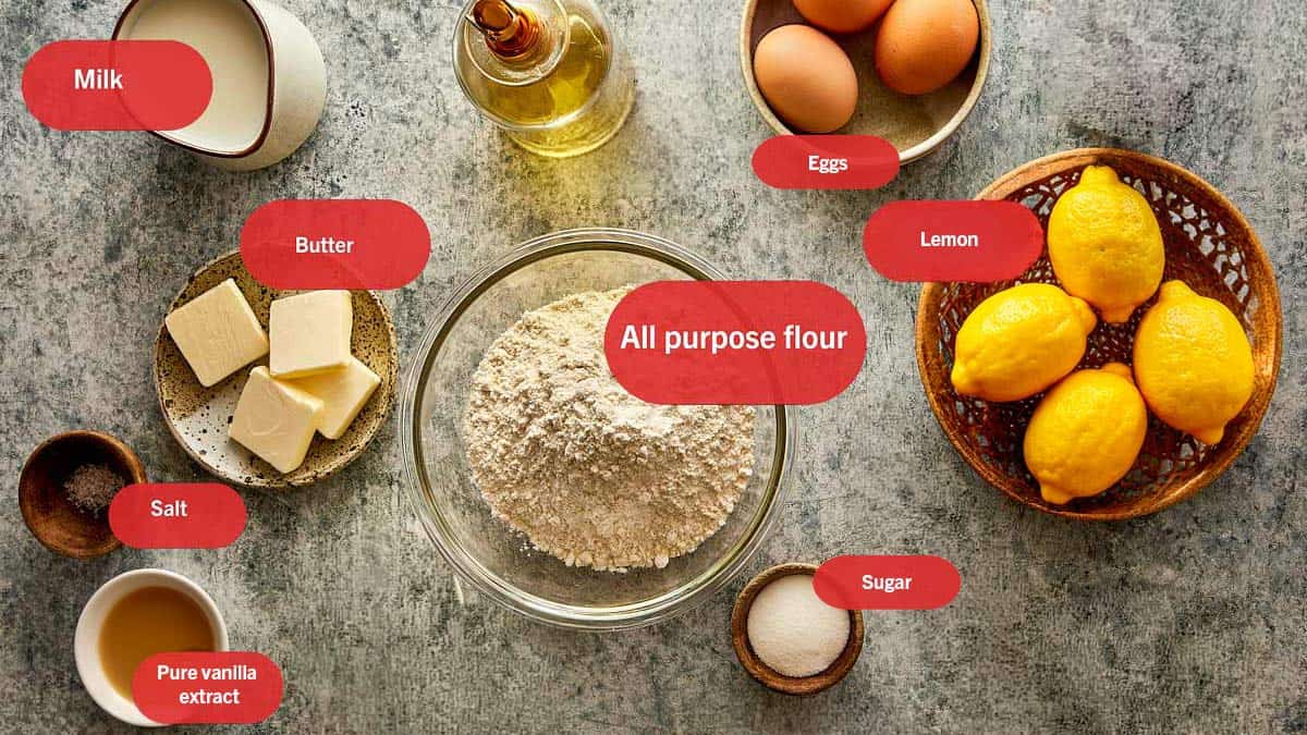 Top view photo of flour, sugar, softened butter, eggs, milk, pure vanilla extract, butter, salt, sugar and lemon