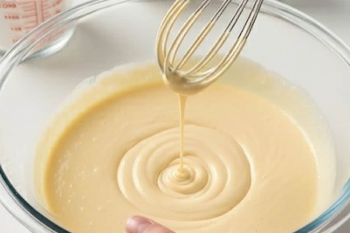 Continue whisking until the batter is silky and runny.