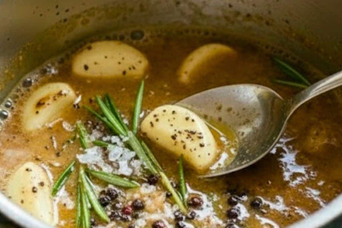 Add smashed garlic cloves, herb sprigs, salt, and pepper. Stir gently to brown the garlic and lift any flavorful browned bits from the pan. - 6