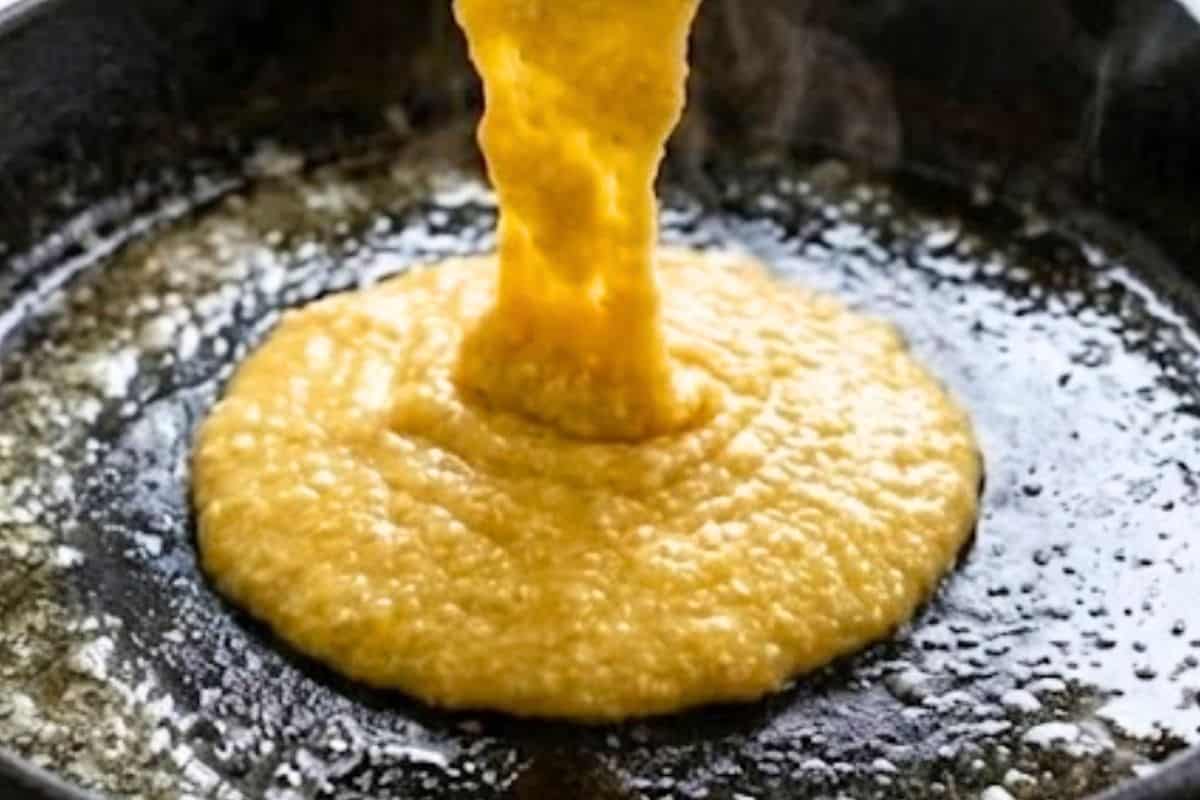 Carefully remove the hot skillet or dish from the oven and pour the batter straight in.