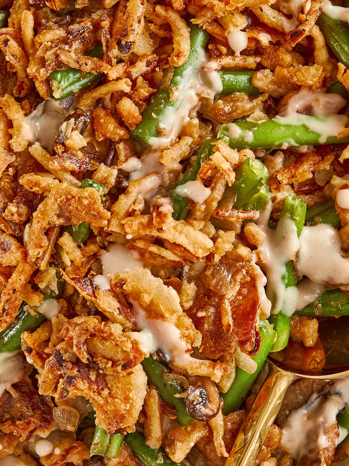Crunchy Green Bean Casserole with homemade cream of mushroom soup and French fried onions!