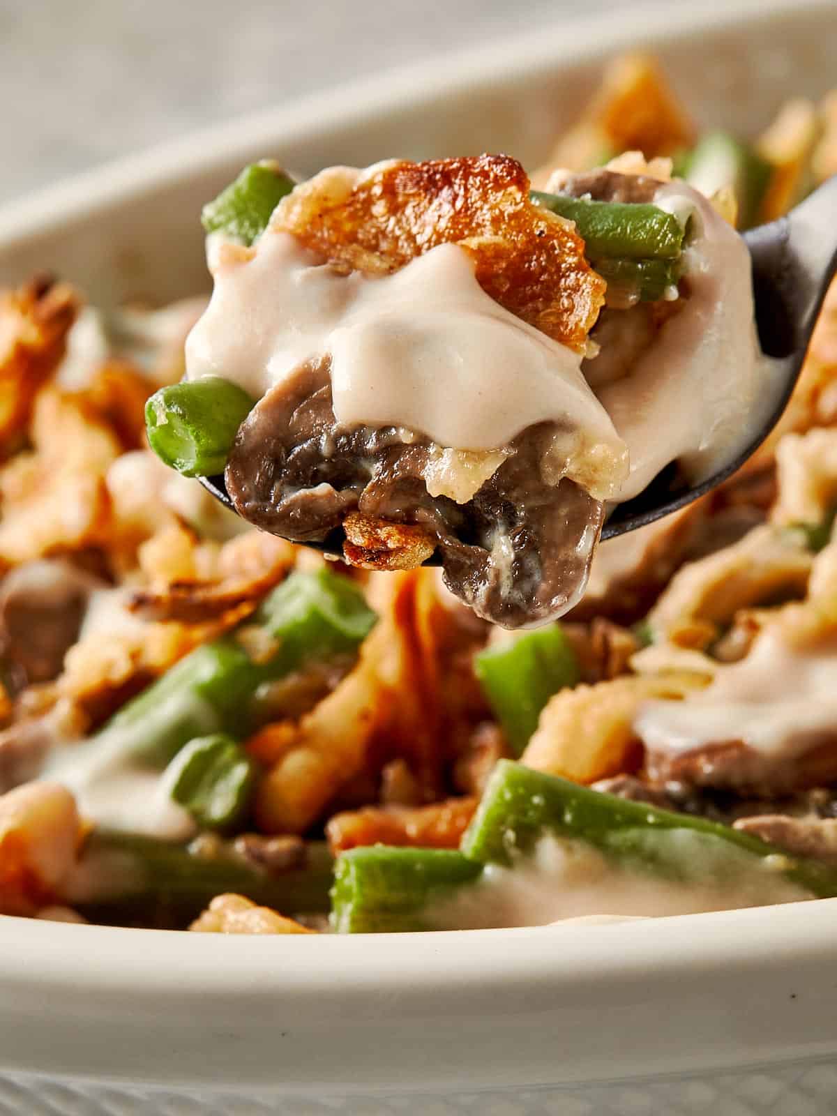Crunchy Green Bean Casserole with homemade cream of mushroom soup and French fried onions!