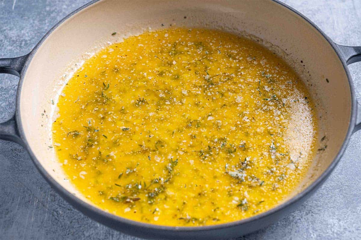 herb butter mixture, melted butter, minced garlic, chopped fresh thyme, salt, and pepper in a pan.