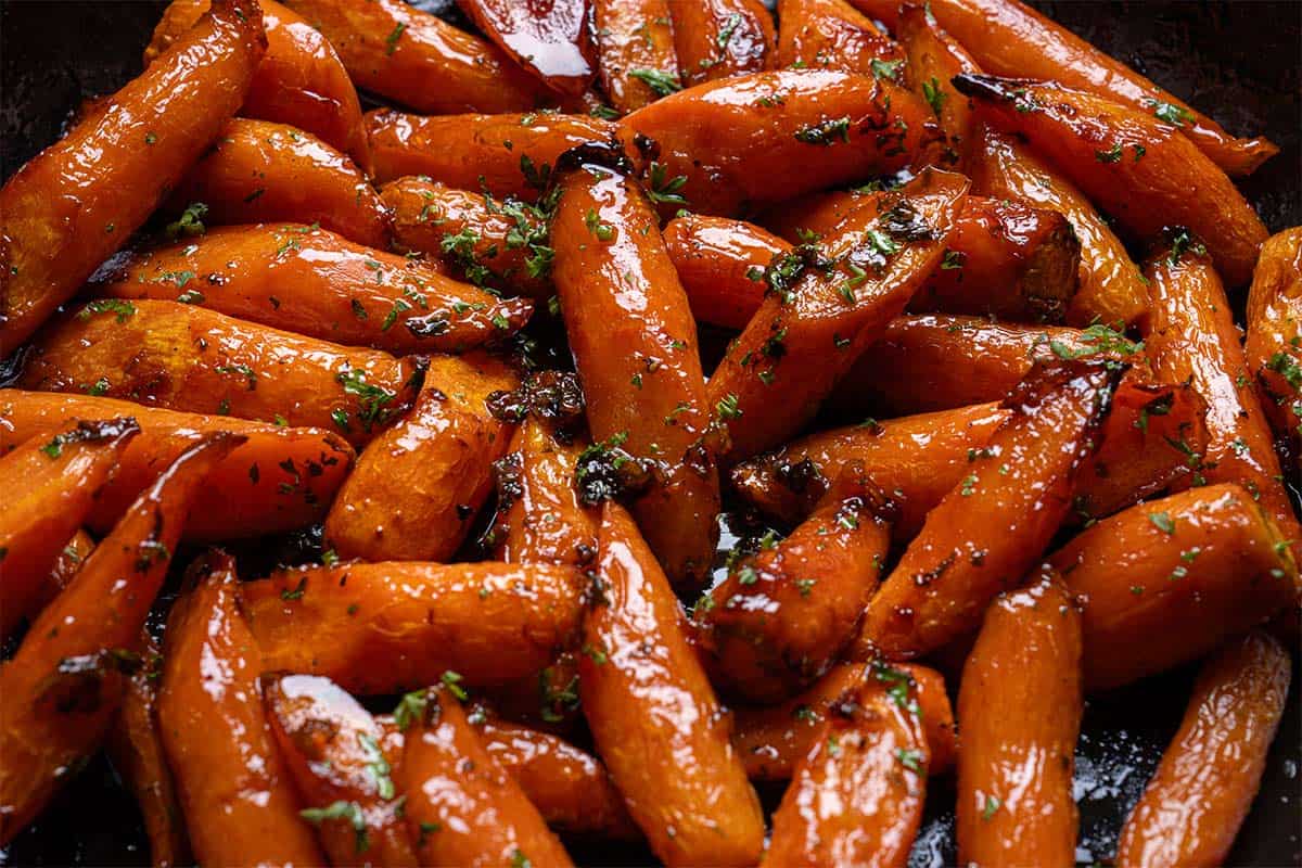 Image of carrots being roasted in the oven for 20 minutes.