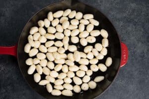 raw gnocchi in a pan
