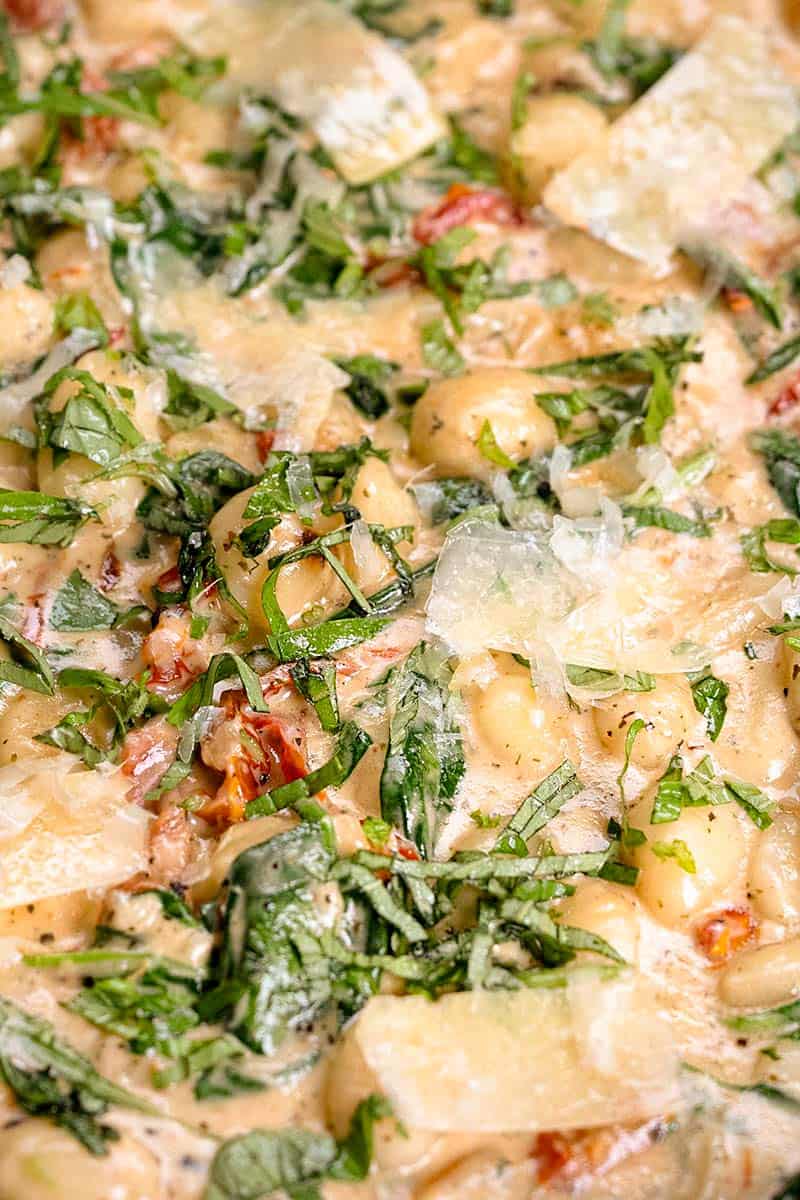 A close up image of creamy gnocchi.
