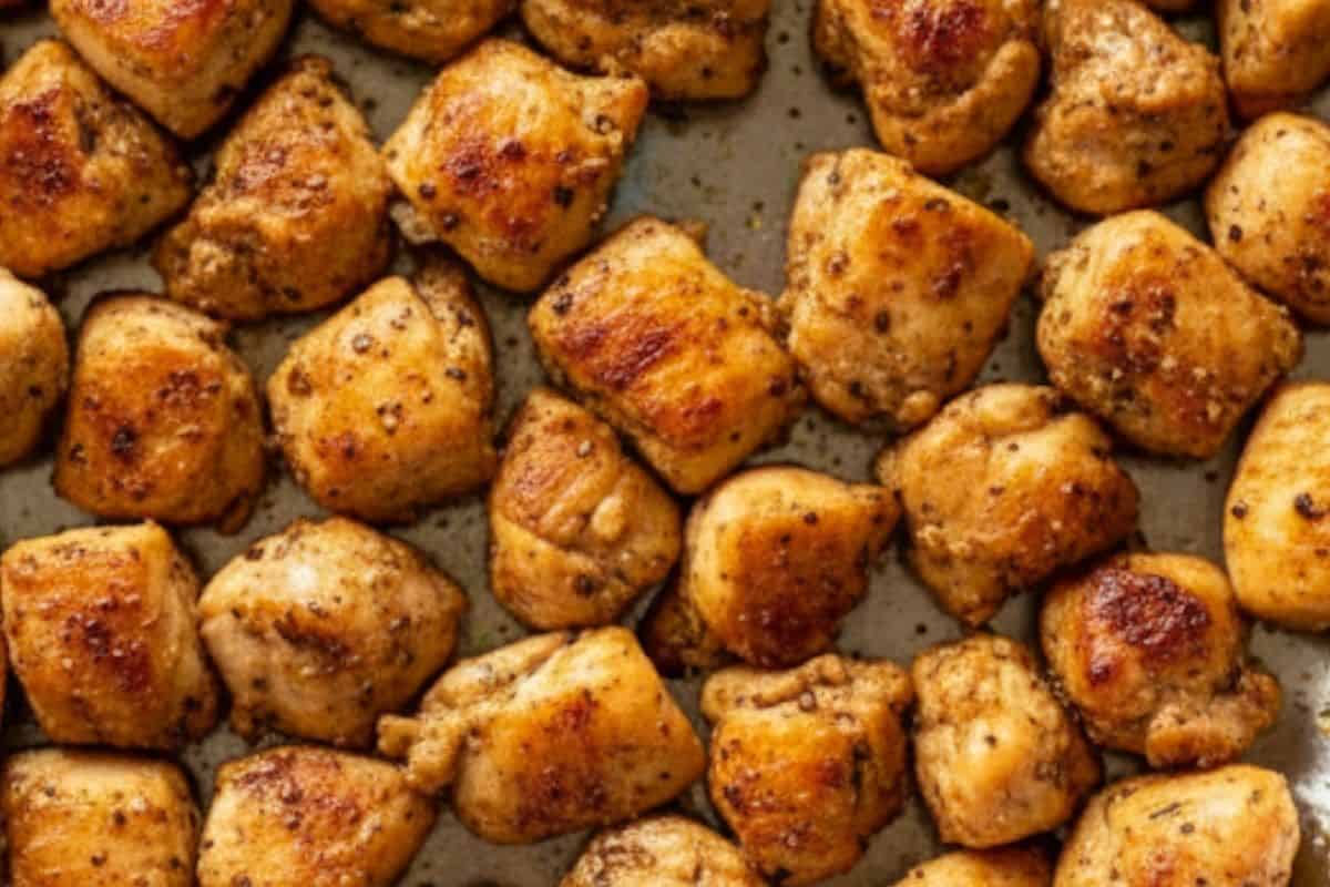 Heat 1 tablespoon of oil in a skillet, add chicken, season with spices, and cook until browned, about 5–6 minutes. 