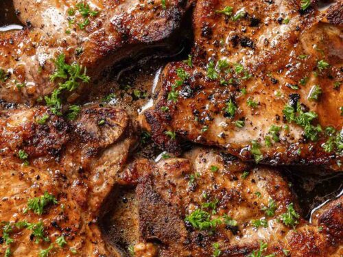 Pork chops in a black pan