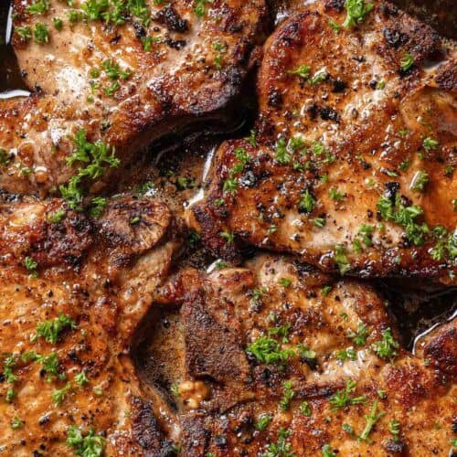 Pork chops in a black pan