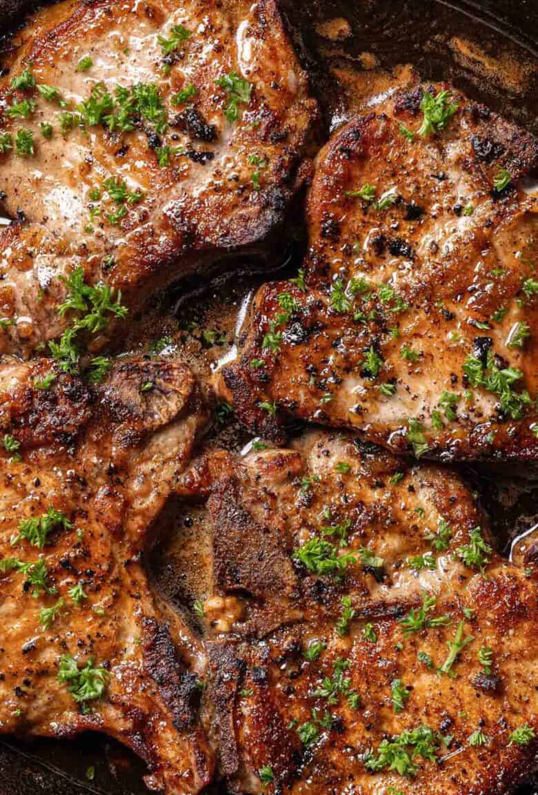 Pork chops in a black pan