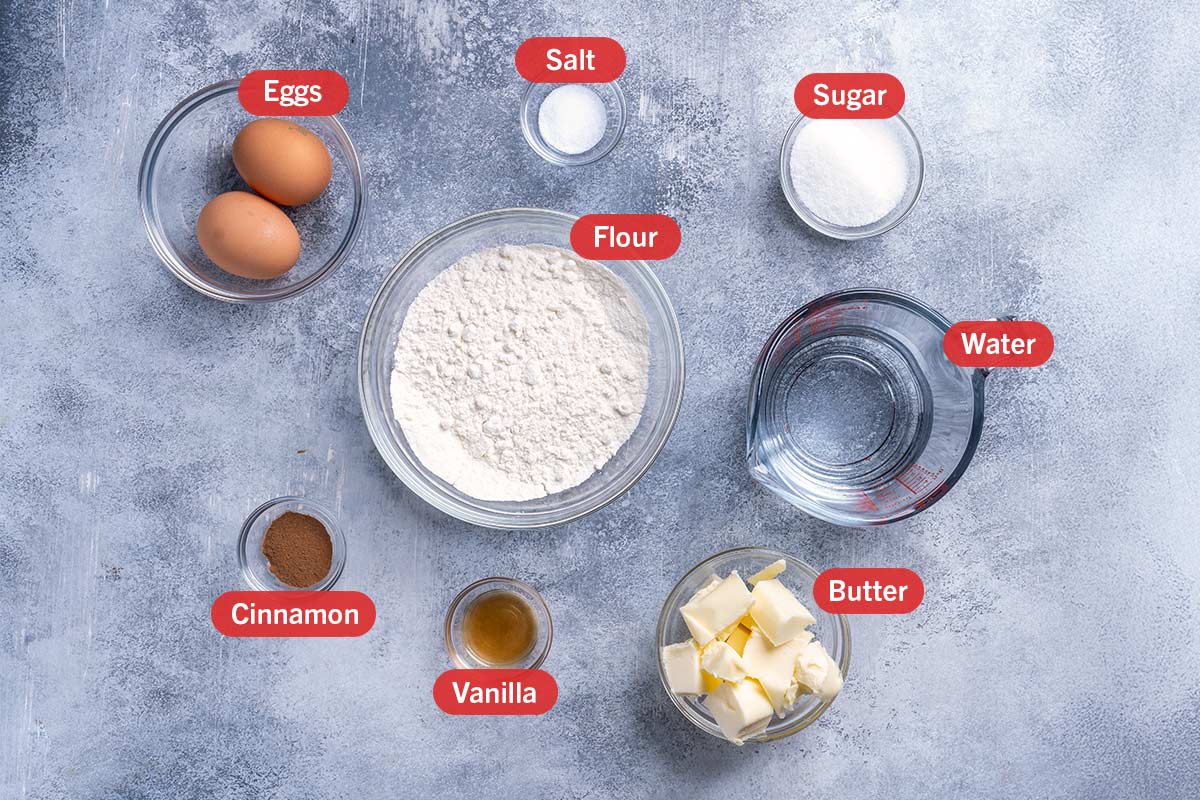 Image of the ingredients needed for the preparation of churros, specifically: flour, water, sugar, eggs, cinammon, vanilla, butter.