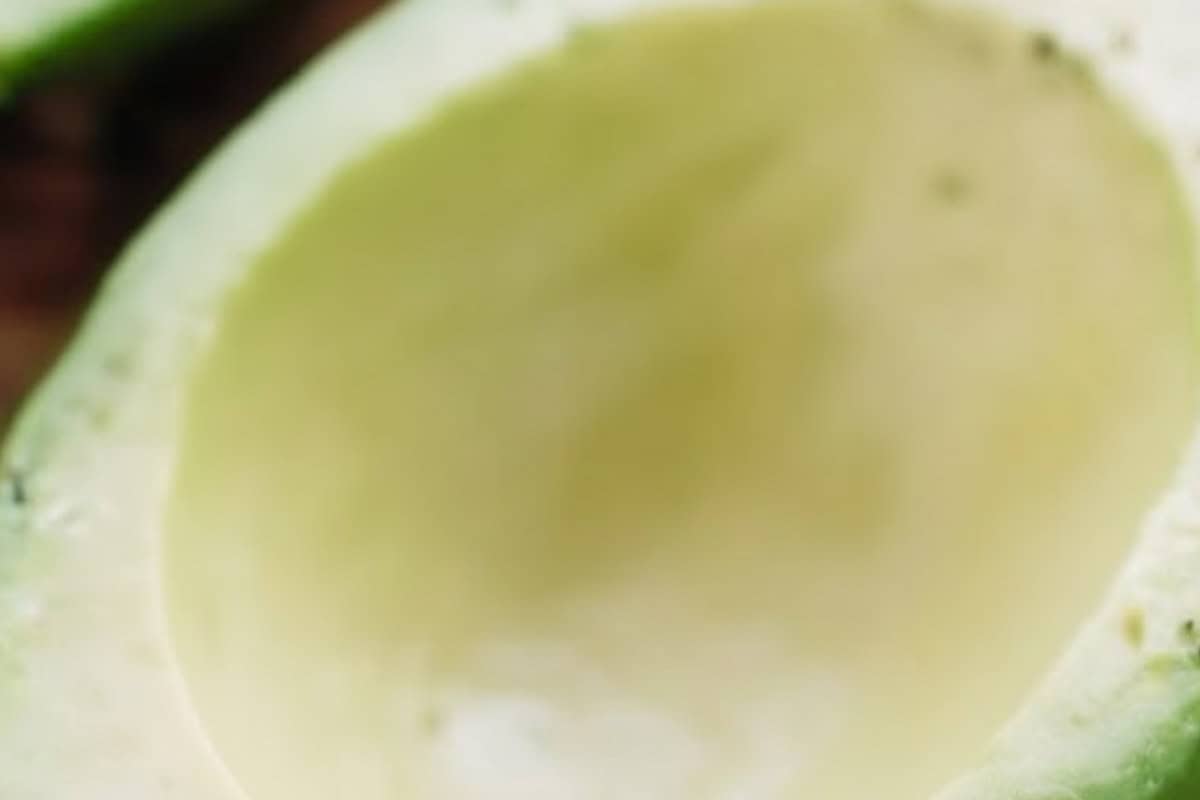 Halve and pit the avocados, then gently remove the skins. Scoop out some of the flesh to create a small “boat,” - 4